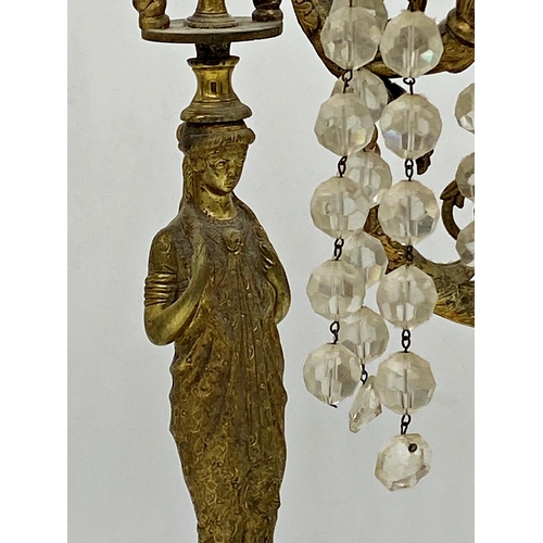 421 - French Empire ormolu figural candlestick with three nautilus scrolled branches terminating in semi-n... 