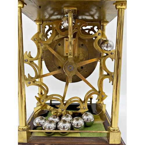 305 - Patent spherical weight clock by Harding & Bazeley of Cheltenham, surmounted by a track delivering s... 