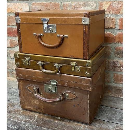 424 - Two leather hard cases, probably dressing cases, one with studded exterior together with a further l... 