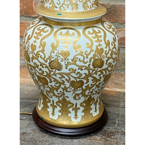 504 - Large Chinese porcelain ginger jar table lamp with scrolled gilt overlay, 50cm high