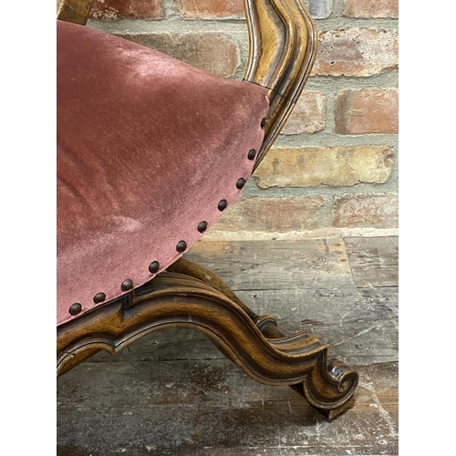 1135 - A continental Savonarola throne chair, with studded pink velvet upholstery and good fluted moulded a... 