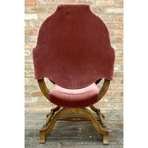 1135 - A continental Savonarola throne chair, with studded pink velvet upholstery and good fluted moulded a... 