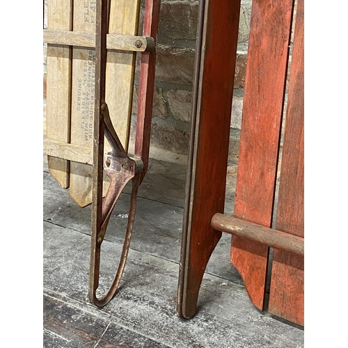 1003 - A flexible flyer American sledge, the timber top upon an iron frame, 103cm long together with a furt... 