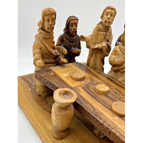 456 - Italian fruit or olive wood carving of The Last Supper, 49cm long