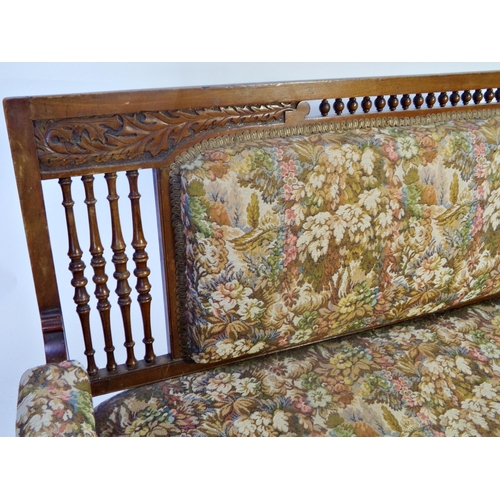 1231 - Liberty style oak framed sofa, with pokerwork and turned column, stuffover back and seat, 145cm long