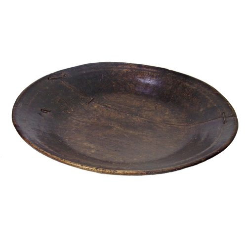 461 - Early primitive treen charger or dish, 51cm diameter