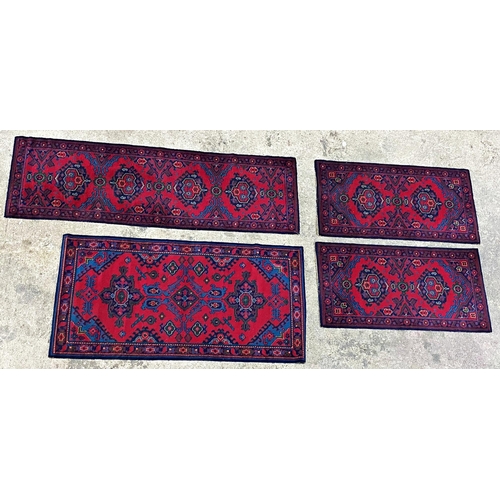 1083 - Turkish carpet, blue medallions on a red ground, 285 x 250, with four matching smaller modern rugs