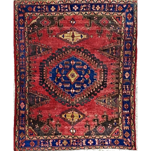 1091 - Turkish full pile rug, central blue medallion, washed red ground, 210 x 165cm