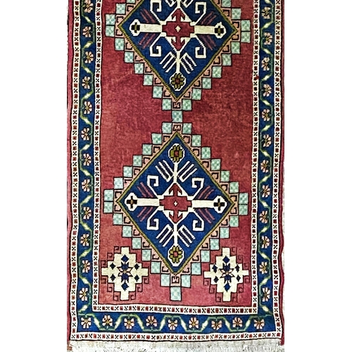 1097 - Turkish runner, five blue medallions, washed red ground, 380 x 90cm