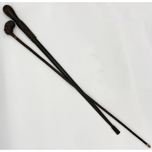 457 - Heavy primitive antique walking stick with concealed cudgel, with a further antique cane the knop ca... 