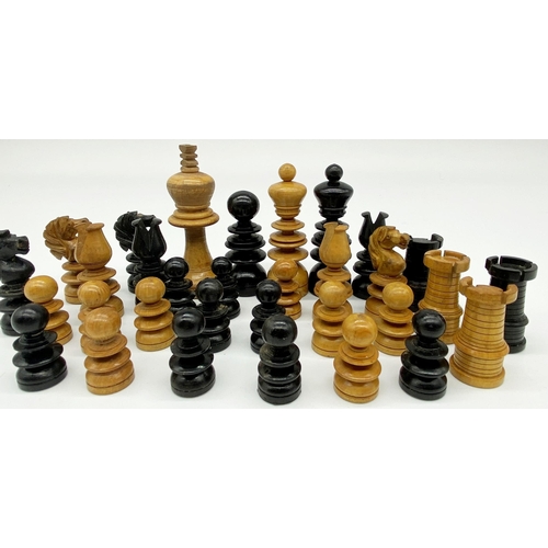 452 - Complete and part complete boxwood and ebony chess sets in the manner of Calvert