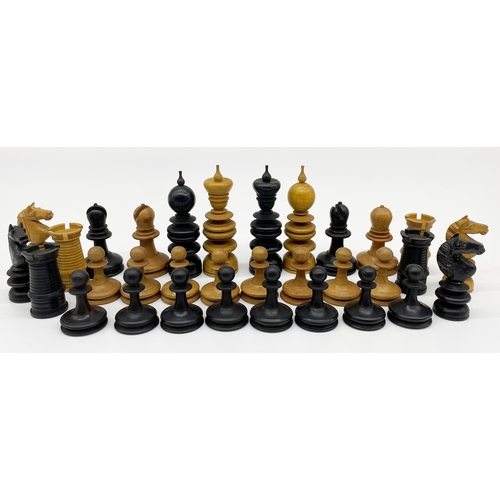 452 - Complete and part complete boxwood and ebony chess sets in the manner of Calvert