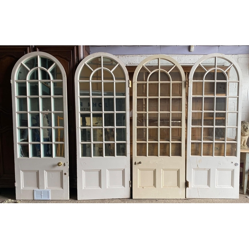 1008 - Set of four Georgian arched interior doors, two fitted with mirror panels, 135cm high x 87cm wide