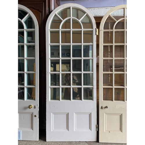 1008 - Set of four Georgian arched interior doors, two fitted with mirror panels, 135cm high x 87cm wide