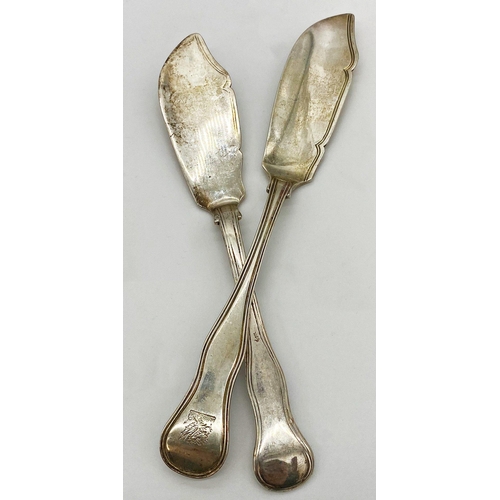 24 - Two Antique silver butter knives, with wavy fiddle handles, Victorian and 1912 respectively, 5oz app... 