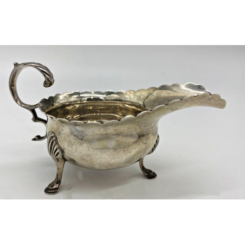 47 - Edwardian silver sauce boat, silver shilling inset base, maker Thomas Bradbury & Sons Ltd, Sheffield... 