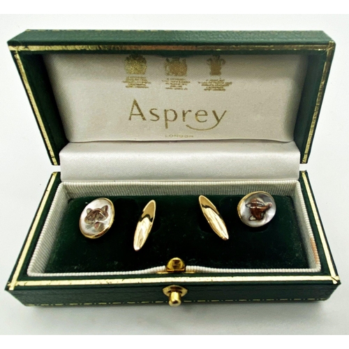 182 - A pair of yellow metal cuff links set with painted and intaglio carved Essex crystals depicting a fo... 