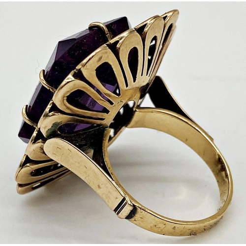 206 - A 14ct gold vintage ring set with a large faceted Amethyst stone. Size M 1/2, weight 12.4 grams appr... 