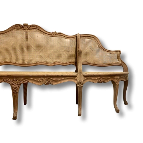 1253 - Good French carved wood and Bergere cane conversation sofa, 260cm wide x 100 high x 75 deep