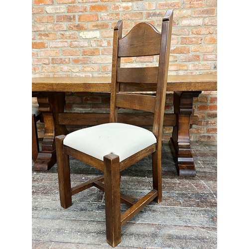 1200A - Substantial stained oak refectory dining table, the moulded top on pegged lyre supports united by a ... 