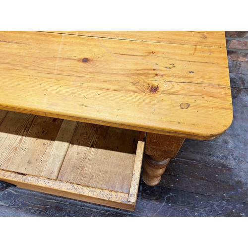 1235 - Victorian pine kitchen table, fitted with two drawers on turned legs 180cm long x 108cm wide