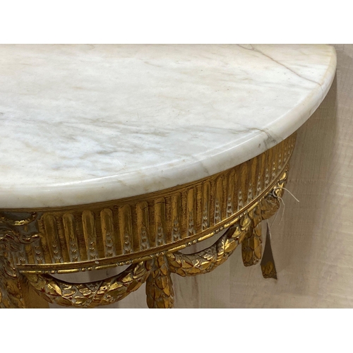 1140 - Marble topped gilt wood demi-lune Adams style console table decorated rams head and swags, 87cm high... 