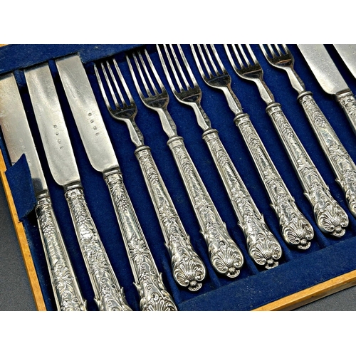 30 - Part fitted satinwood canteen of cutlery, with six silver handled knives and forks