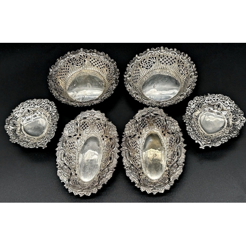 71 - Three pairs of silver bonbon or pin dishes all with typical pierced decoration, 7oz approx (6)