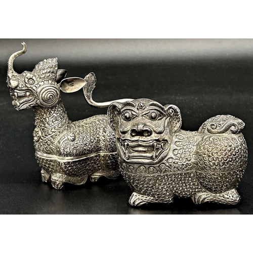 89 - Far Eastern silver character betel nut boxes in the form of a dragon and dog of foo, 12 & 9cm long r... 