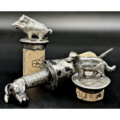 98 - Pair of white metal (untested) cork toppers in the form of a gun dog and boar, together with a Peruv... 