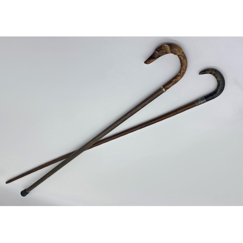 468 - A horn handled, silver collard bamboo walking cane together with a further crook handle dog headed c... 