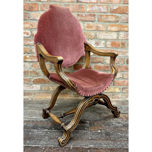 1463 - A continental Savonarola throne chair, with studded pink velvet upholstery and good fluted moulded a... 