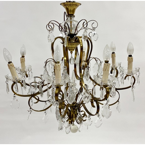 1235 - Good continental gilt brass chandelier with eight scrolled branches and sconces and various prismati... 