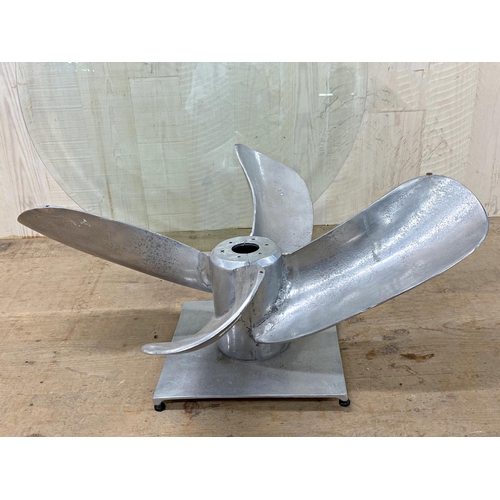 1330 - Novelty Mid-century aluminium propeller coffee table, with bevelled glass top, 38cm high x 91cm diam... 