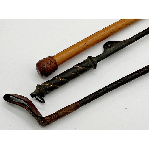 1106 - Three antique riding crops to include a plaited leather example 62cm long, with a framed Snaffles tr... 