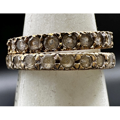 296 - Two 9ct paste set eternity rings, size M and P, 3.3g