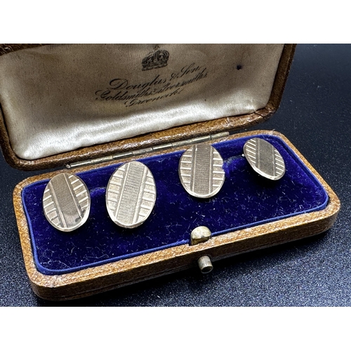 297 - Cased pair of 9ct engine turned cufflinks, 6g (2)