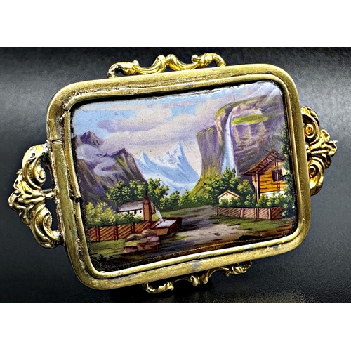 313 - Continental high carat yellow metal brooch, fitted with an enamel Alpine landscape, 5cm wide, 7.4g g... 