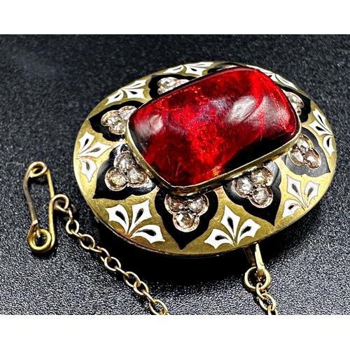 314 - Impressive Victorian garnet, diamond and enamel brooch, the large central stone framed by 24 diamond... 