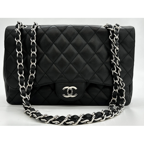 451 - Chanel black caviar jumbo classic double flap handbag. 
This timeless Chanel Classic is in black cav... 