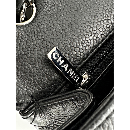 451 - Chanel black caviar jumbo classic double flap handbag. 
This timeless Chanel Classic is in black cav... 