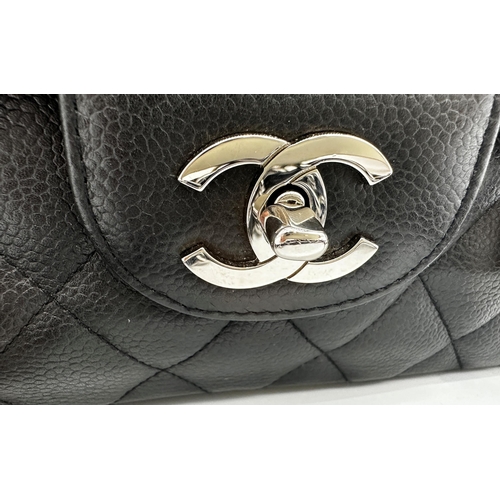 451 - Chanel black caviar jumbo classic double flap handbag. 
This timeless Chanel Classic is in black cav... 