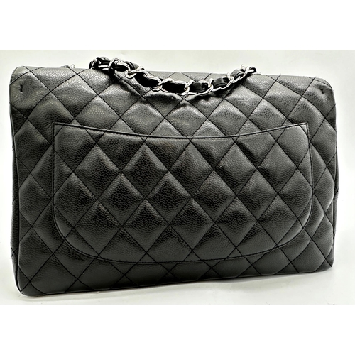 451 - Chanel black caviar jumbo classic double flap handbag. 
This timeless Chanel Classic is in black cav... 