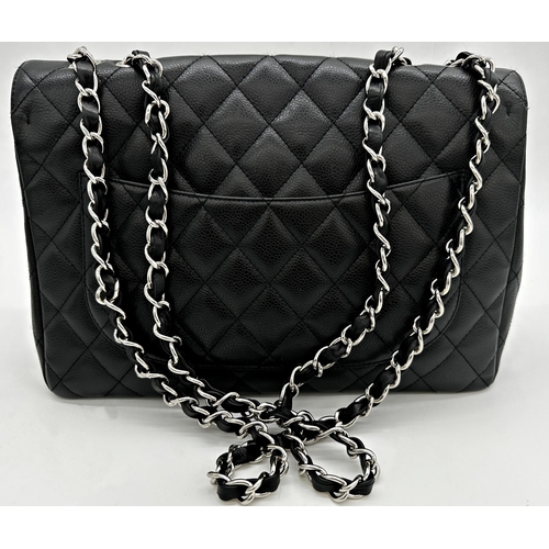 451 - Chanel black caviar jumbo classic double flap handbag. 
This timeless Chanel Classic is in black cav... 