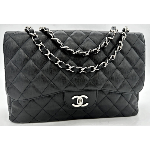 451 - Chanel black caviar jumbo classic double flap handbag. 
This timeless Chanel Classic is in black cav... 