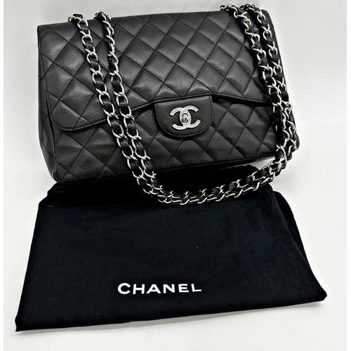 451 - Chanel black caviar jumbo classic double flap handbag. 
This timeless Chanel Classic is in black cav... 