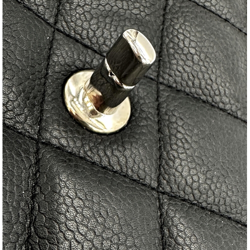 451 - Chanel black caviar jumbo classic double flap handbag. 
This timeless Chanel Classic is in black cav... 