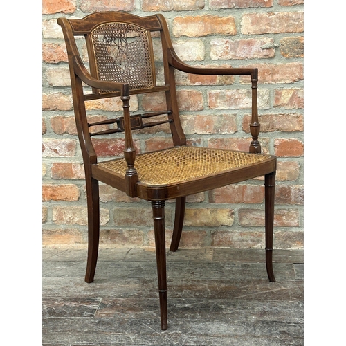 1450 - Regency style flame mahogany bergère carver chair, boxwood strung, upon good turned front legs (af)