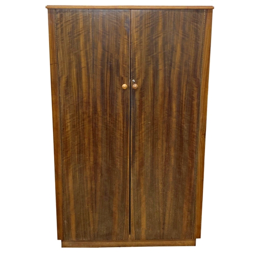 1295 - Morris of Glasgow three piece bedroom suite comprising compactum wardrobe, three drawer chest and he... 