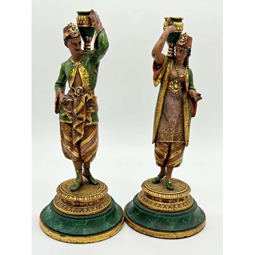 1172 - Good pair or painted spelter figural candlesticks or table lamps, moddelled as an Arabic water carri... 